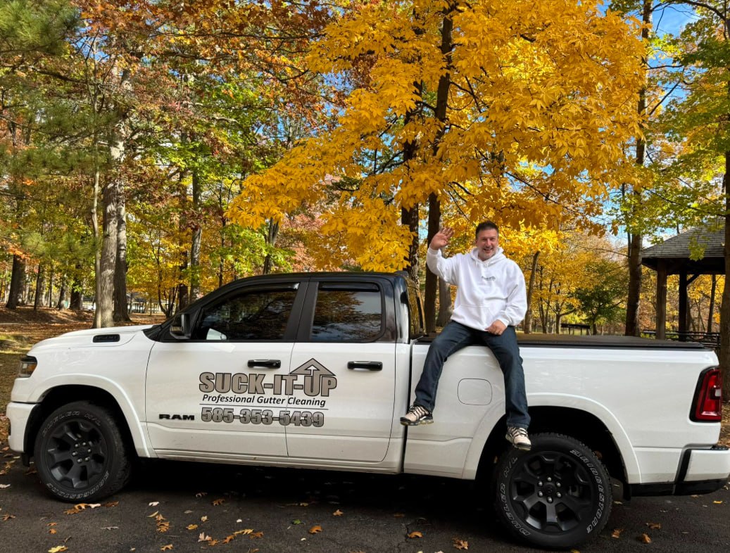 Steve, owner of Suck-It-Up Gutter Cleaning, standing beside the Suck-It-Up truck